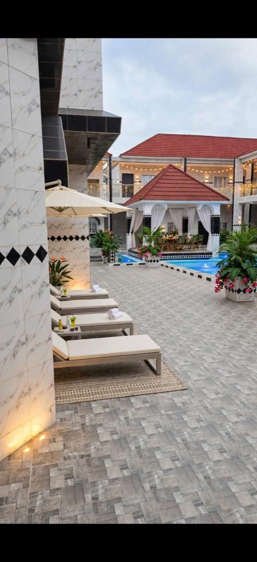 Courtyard, sun loungers and pool pavilion
